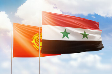 Sunny blue sky and flags of syria and kyrgyzstan
