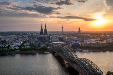 Fototapeta na wymiar Aerial view of Cologne Cathedral and Hohenzollern Bridge at sunset, Germany
