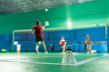 badminton courts with players competing