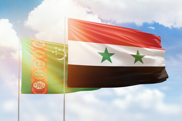 Sunny blue sky and flags of syria and turkmenistan