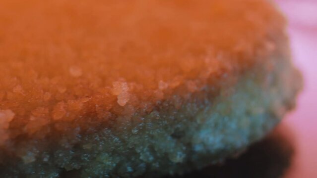Close-up of fried juicy cutlets in breadcrumbs in a frying pan.