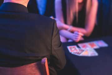 Process of tarot card reading and future fate prediction, fortune teller medium with a deck of...