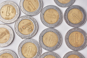 Mexican money, Mexican pesos bills and coins on white background
