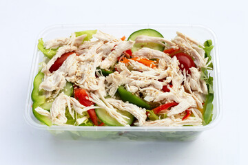 Salad with shredded chicken and vegetables in plastic package box