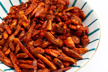 Fried Chili, Spicy snack on white background.