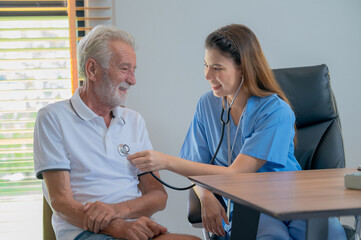 Fototapeta premium Nurses are caring for elderly patients at home. Home care concept