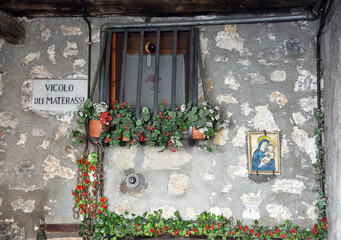 glimpse of the historic center of the medieval village religious votive shrine village Bolsena Italy