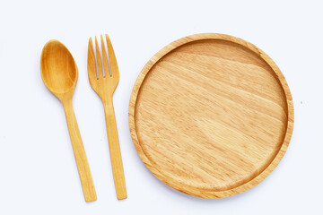 Wooden plate with spoon and fork