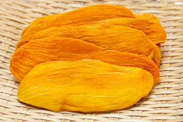 Dried mango in bamboo plate
