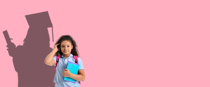 Cute African-American schoolgirl on white background