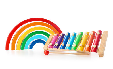 Rainbow made of blocks and xylophone toy on white background