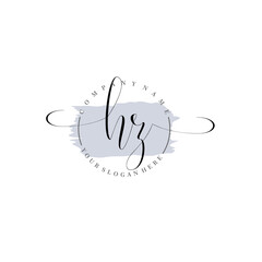 HZ Initial handwriting logo vector. Hand lettering for designs.