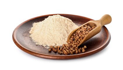 Plate of flour and scoop with buckwheat grains on white background