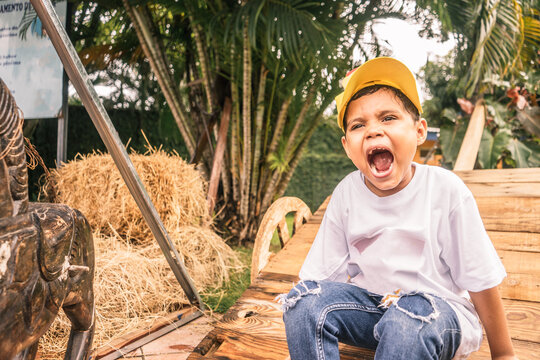 Rancher Boy Screaming On A Farm In Latin America Outdoors