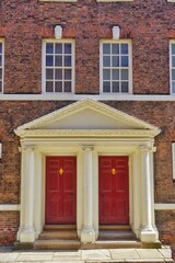 Two Red Georgian Doorways and windows house frontage