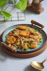 a plate of stir fry tofu with vegetables 