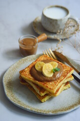 a plate of french toast with jam 