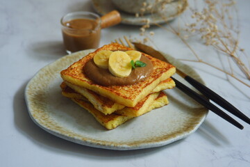 a plate of french toast with jam 