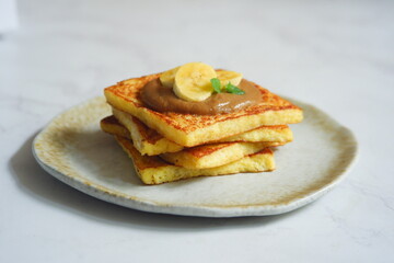 a plate of french toast with jam 