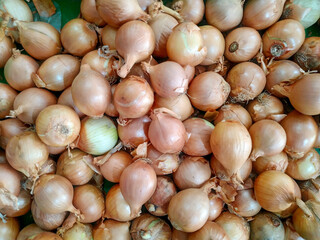 Top View Onion (Bawang Bombay) in Indonesian market. Bawang bombay or Onions are now hard to find in traditional Indonesian markets and are expensive.