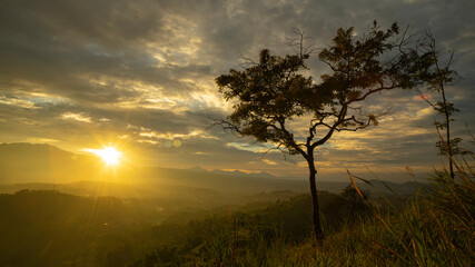 Fototapeta na wymiar Sunrise Scene of Mountain Range and Fog in Wes Java Province, Indonesia