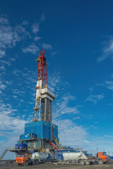 General view of a drilling rig for drilling wells at an oil and gas field in the Arctic region. Equipment for cementing casing columns lowered into the well