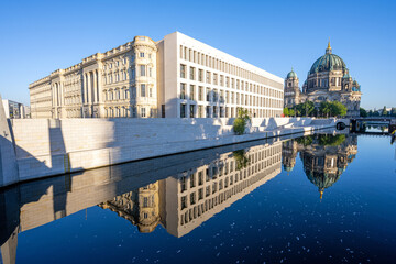 The rebuilt City Palace with the Berliner Dom reflected in the river Spree © elxeneize