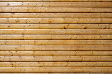 Background from a wall made of painted brown wooden planks