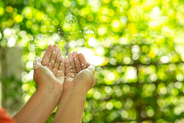Technology, hand holding with environment Icons over the Network connection on green background