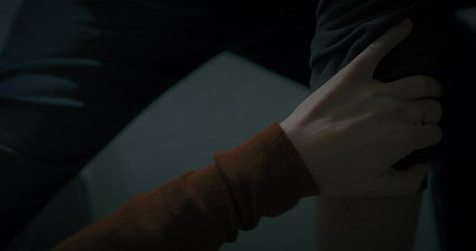 Attacker strangles woman in orange hoodie who tries to fight him off then her arm goes limp at night