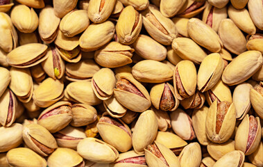 Pistachios in the shell, not peeled, snack. Texture close-up