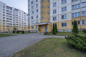 view of residential area with multi-storey skyscraper building and and improved courtyard area