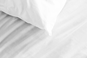 Mattress and white pillows in the bedroom with copy space.