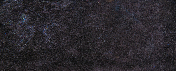 Dark texture of old suede leather. Abstract background with copy space