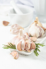 Fresh garlic bulbs with rosemary.