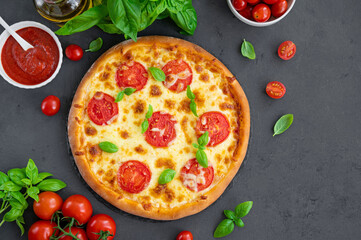 Fresh traditional Italian pizza Margarita or margharita with tomato sauce, mozzarella cheese and...