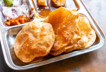 Poori served with Aalo sabzi at a roadside stall