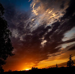 Dramatic summer sunset looking at the horizon and sky in a large composite file