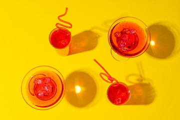 Pink summer cocktails on color background close up