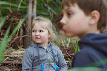 cute little children having fun at camping in countryside