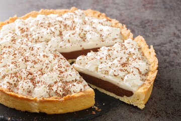 Hawaii Style Chocolate Haupia Pie Recipe closeup in the plate on the table. Horizontal