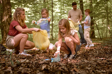 Caucasian family collect garbage from forest
