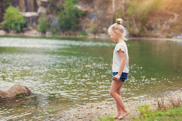 Fototapeta premium girl walking in the water