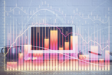 Forex market chart hologram and personal computer background. Multi exposure. Concept of investment.