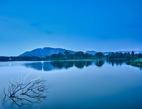 Beautiful dreamy landscape of lake and hill in night time of Bangalore