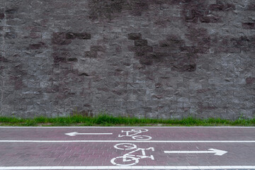 Bicycles dual lane under spacious stone empty wall with copy space for mock up at urban street...