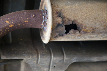 Old muffler expire.rust on muffler exhaust pipe system