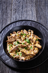 liver stroganoff in black bowl, top view