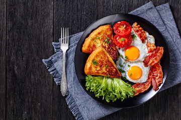 irish breakfast of fried eggs, bacon, potato farls