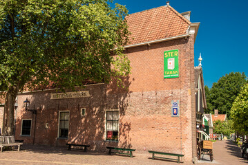 Fototapeta na wymiar Enkhuizen, Netherlands, June 2022. The old streets at the Zuiderzee Museum in Enkhuizen.